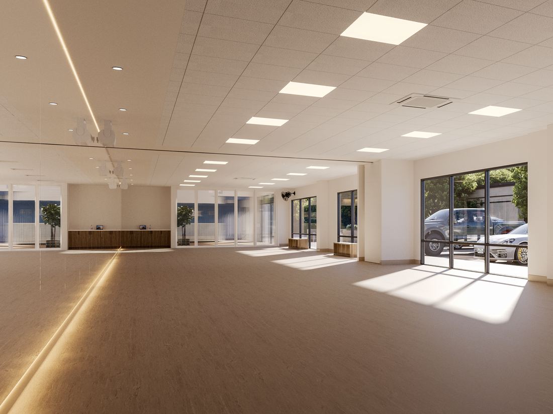 An APAX dance studio: a large open room with a lit mirror wall, and big sunny windows